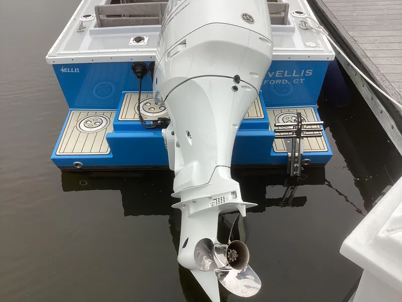 Slide: The Image of 1993 Ellis Downeast Hardtop boat with outboard motor at dock. - 2