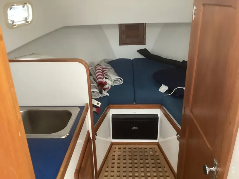 Slide: The Image of 1993 Ellis Downeast Hardtop cabin interior with sink and bed - 22