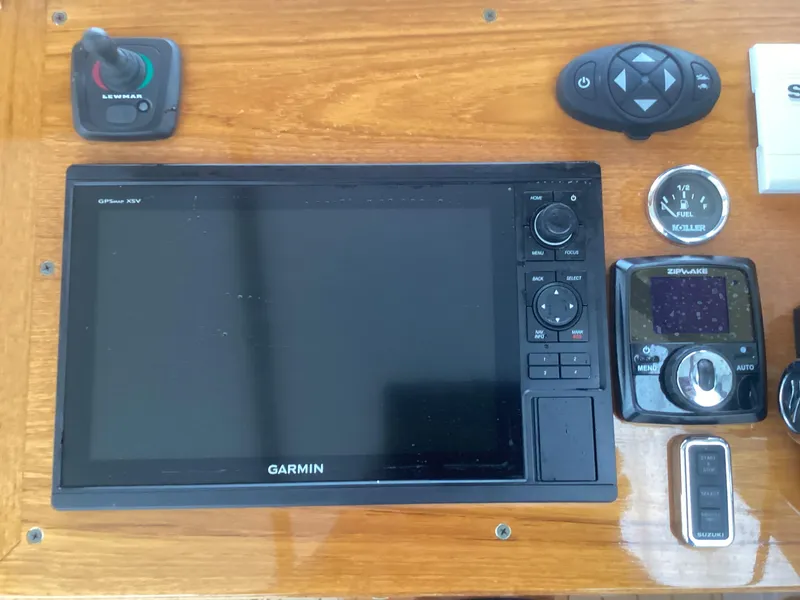 Slide: The Image of Garmin GPS display and controls on 1993 Ellis Downeast Hardtop boat dashboard. - 24