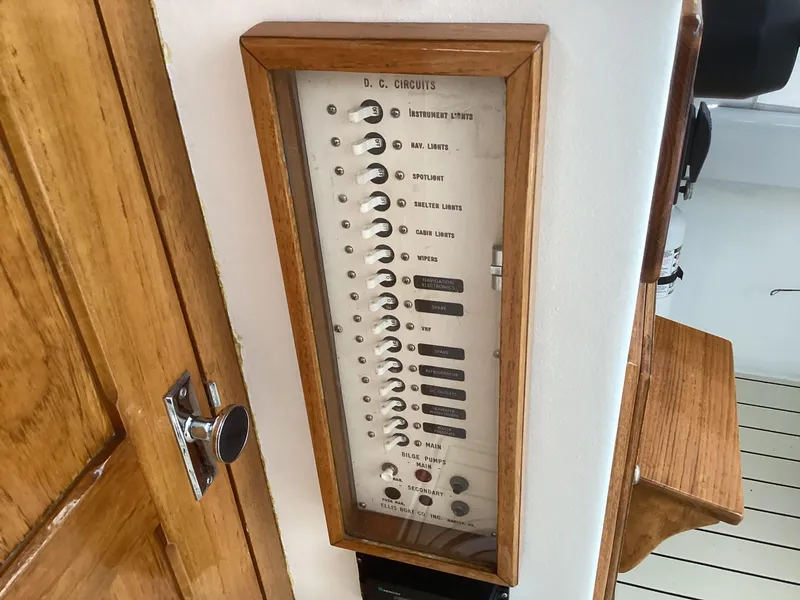 Slide: The Image of 1993 Ellis Downeast Hardtop DC circuits control panel with wooden frame. - 31