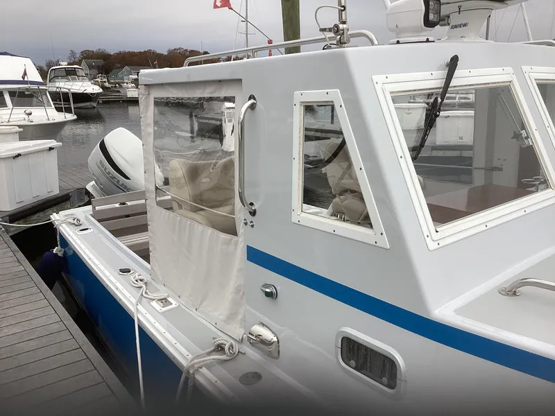 Slide: The Image of 1993 Ellis Downeast Hardtop boat docked at marina, side view. - 4