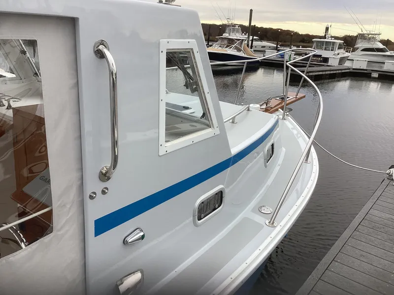 Slide: The Image of 1993 Ellis Downeast Hardtop boat docked at marina. - 6