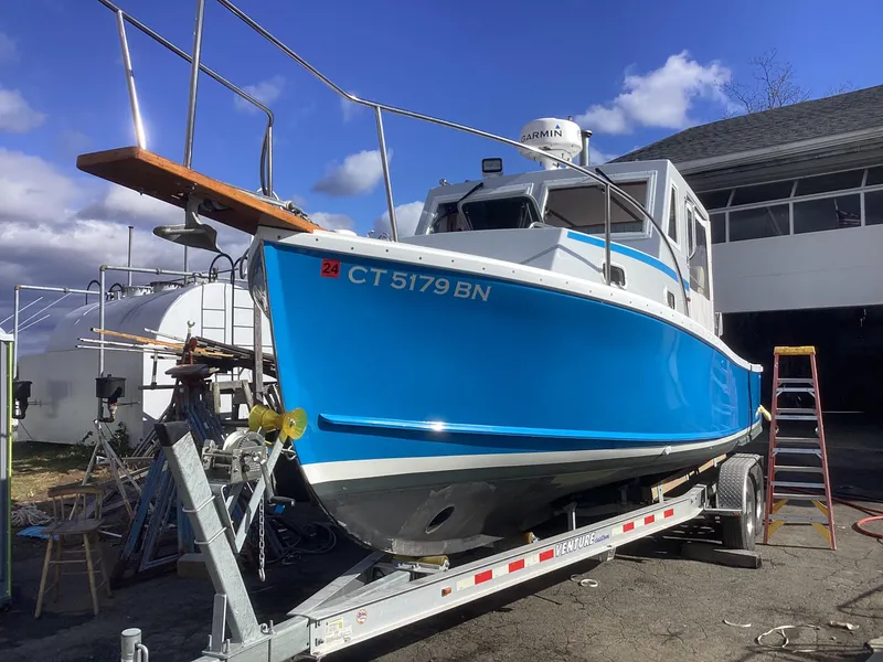 Slide: The Image of 1993 Ellis Downeast Hardtop boat on a trailer, blue hull, CT 5179 BN. - 9