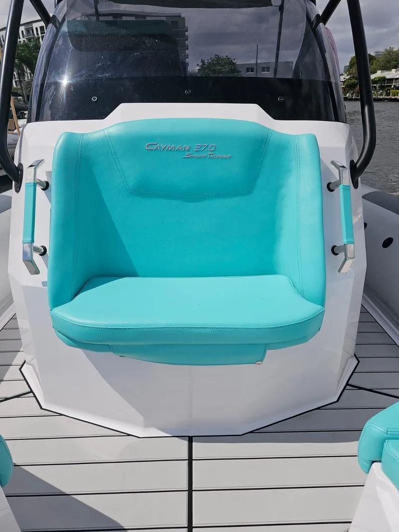 Slide: The Image of 2025 Ranieri CAYMAN 27.0 SPORT TOURING boat with turquoise seating. - 10