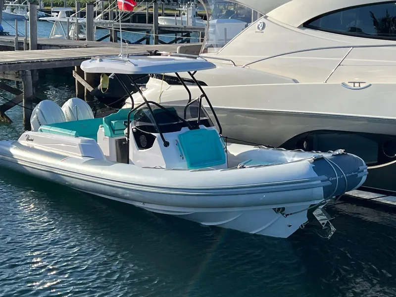 Slide: The Image of 2025 Ranieri CAYMAN 27.0 SPORT TOURING boat docked at marina. - 2