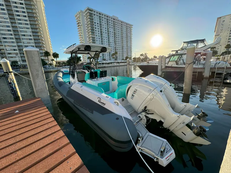 Slide: The Image of 2025 Ranieri CAYMAN 27.0 SPORT TOURING boat docked at marina during sunset. - 36