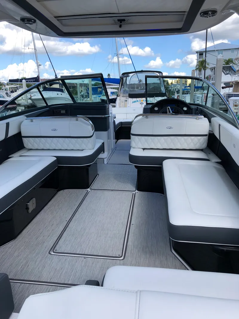 Slide: The Image of 2019 Regal 29 OBX boat interior with white seating and modern design. - 4