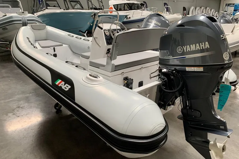 The Image of 2023 AB Inflatables 15ALX boat with Yamaha outboard motor in showroom. - 0