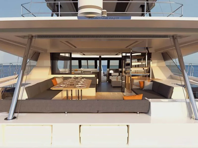 Slide: The Image of Luxurious 2024 Fountaine Pajot Samana 59 yacht with spacious outdoor seating and dining area. - 6