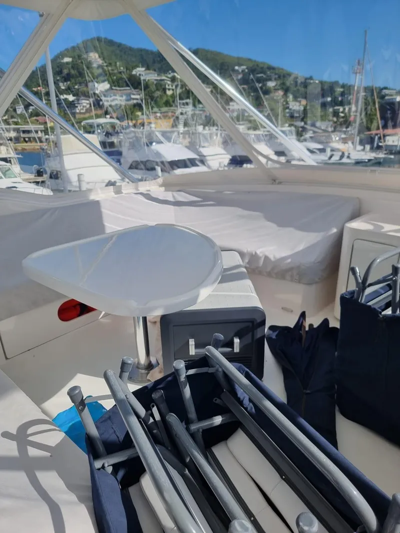 Slide: The Image of 2008 Bertram 670 Convertible yacht interior with marina view. - 11