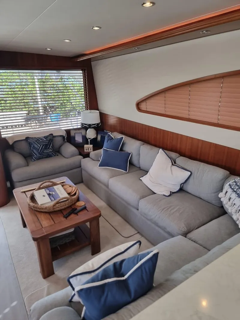 Slide: The Image of Luxurious interior of a 2008 Bertram 670 Convertible yacht with comfortable seating. - 19