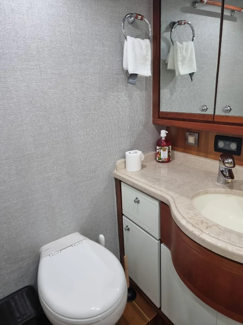 Slide: The Image of Bathroom interior of a 2008 Bertram 670 Convertible yacht with modern fixtures. - 28