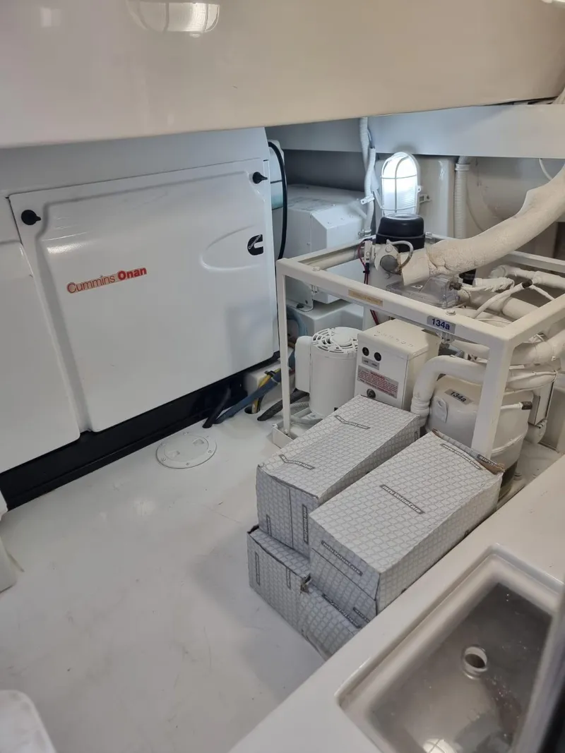 Slide: The Image of Engine room of a 2008 Bertram 670 Convertible yacht with Cummins Onan generator. - 31
