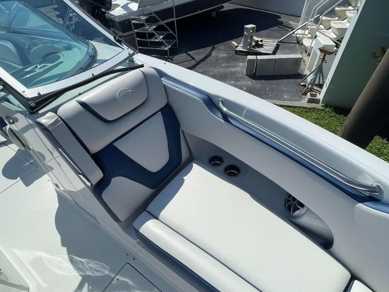 Slide: The Image of 2024 Crownline 250 XSS boat interior with cushioned seating and sleek design. - 10