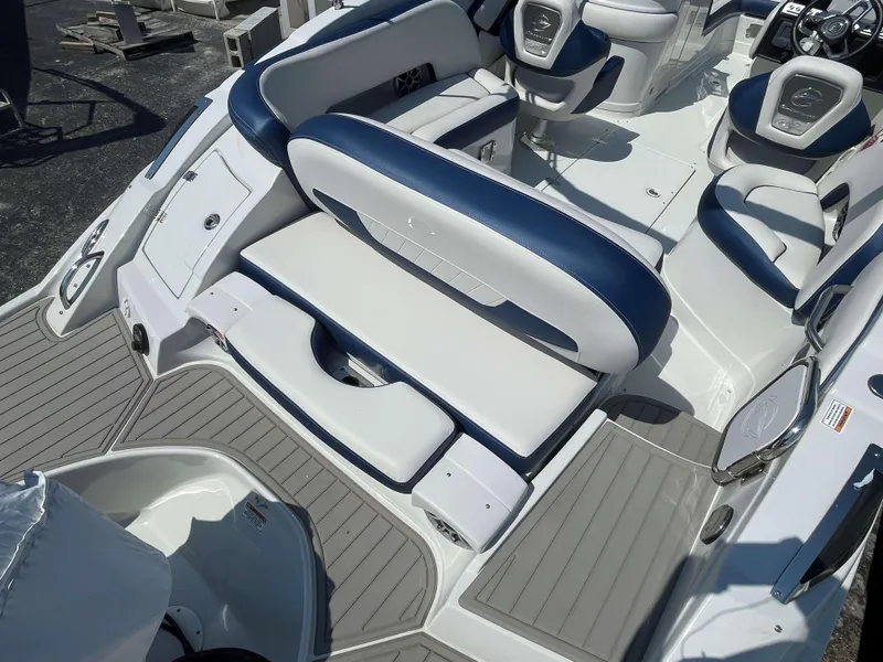 Slide: The Image of 2024 Crownline 250 XSS boat interior with white and blue seating. - 11