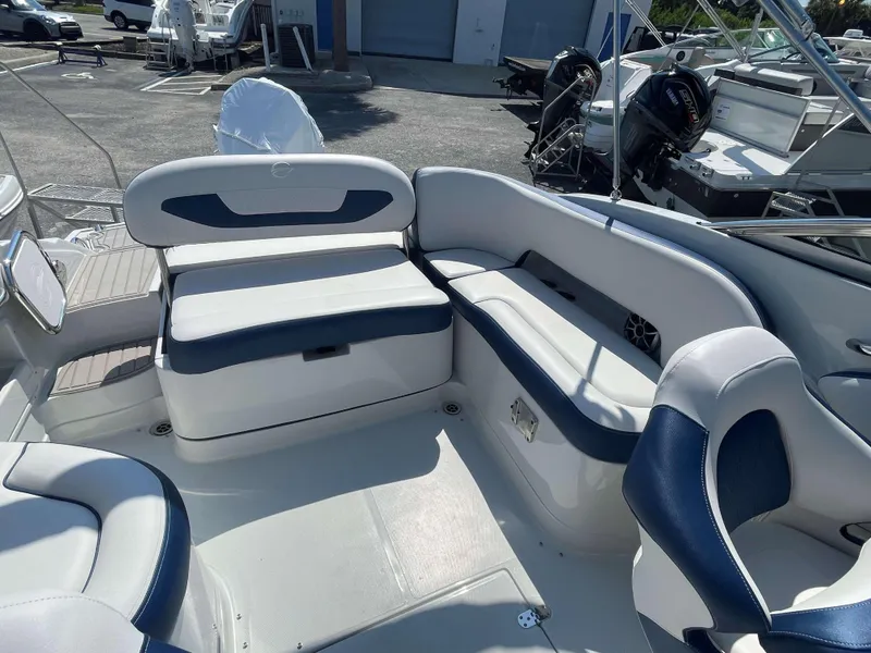 Slide: The Image of 2024 Crownline 250 XSS boat interior with white and blue seating. - 13