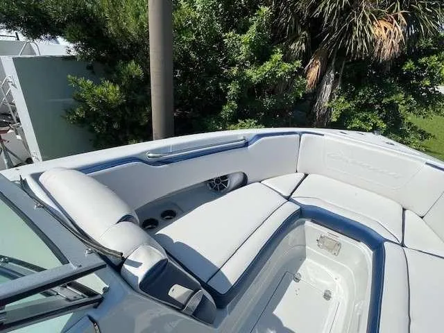 Slide: The Image of 2024 Crownline 250 XSS boat interior with plush seating and sleek design. - 6