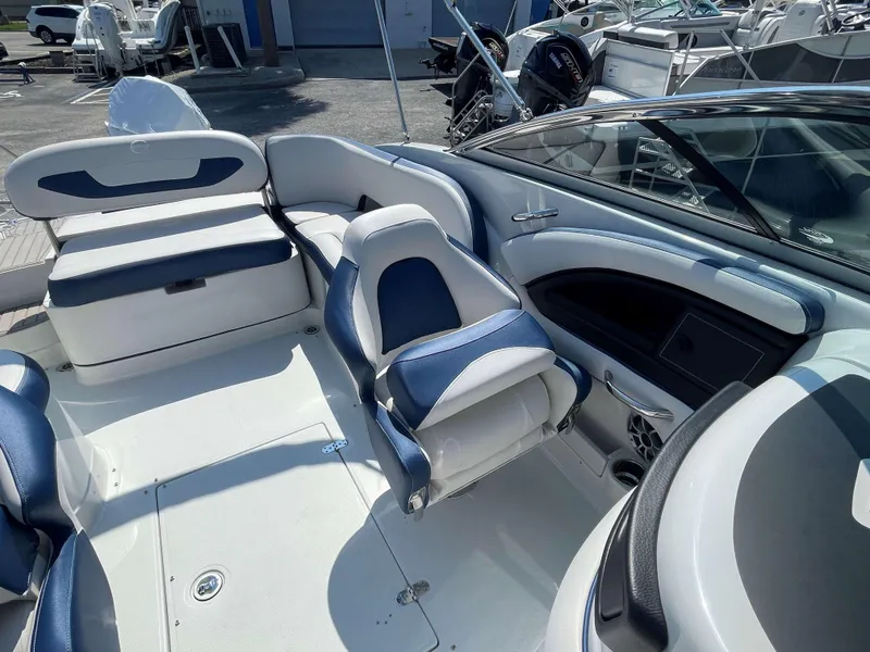 Slide: The Image of 2024 Crownline 250 XSS boat interior with white and blue seating. - 9