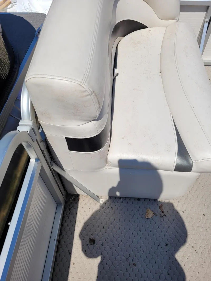 Slide: The Image of 2008 Manitou 20 Oasis boat seat with light wear and dirt. - 13