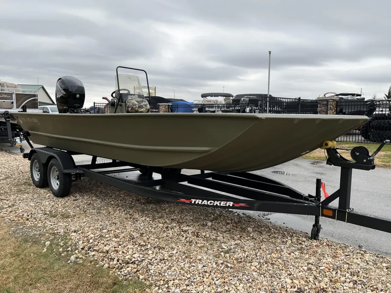 Slide: The Image of 2024 Tracker Grizzly 2072 CC boat on trailer, side view. - 3