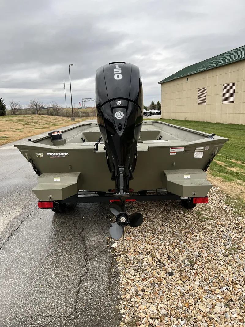 Slide: The Image of 2024 Tracker Grizzly 2072 CC boat with outboard motor, rear view. - 6