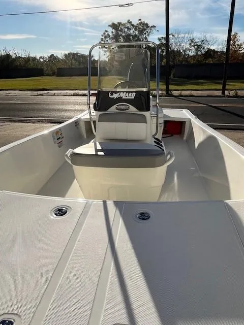 Slide: The Image of 2024 Mako Pro Skiff 15 CC boat interior with console and seating. - 5