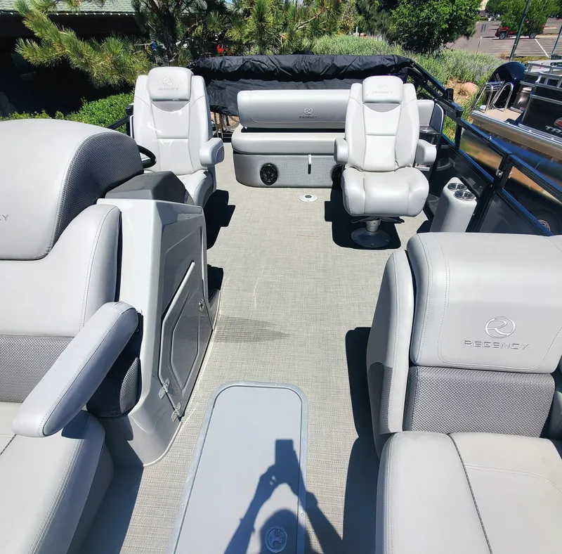Slide: The Image of 2024 Regency 250 LE3 Sport boat interior with luxurious seating and modern design. - 5