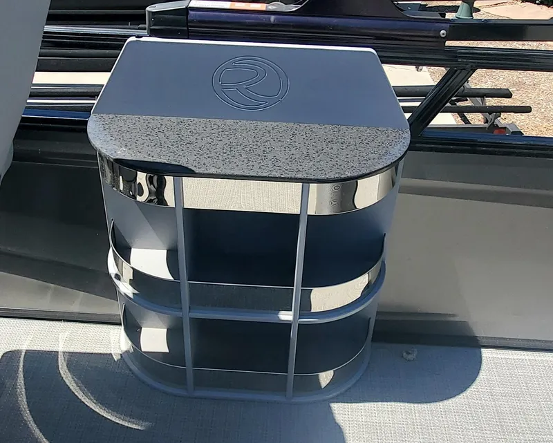 Slide: The Image of 2024 Regency 250 LE3 Sport boat interior storage compartment. - 7