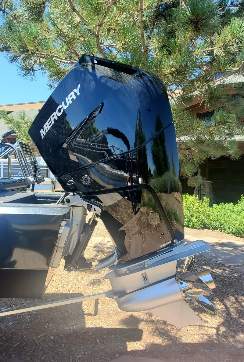 Slide: The Image of 2024 Regency 250 LE3 Sport with Mercury outboard motor. - 8