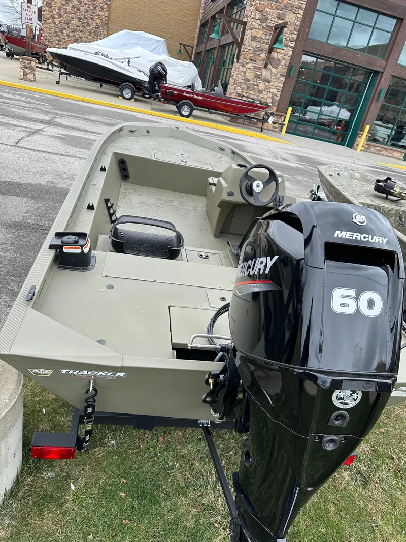 Slide: The Image of 2024 Tracker Grizzly 1754 SC boat with Mercury 60 outboard motor. - 2