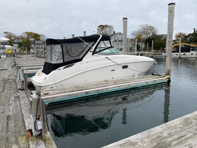Slide: The Image of 2011 Sea Ray 280 Sundancer docked at a marina. - 2