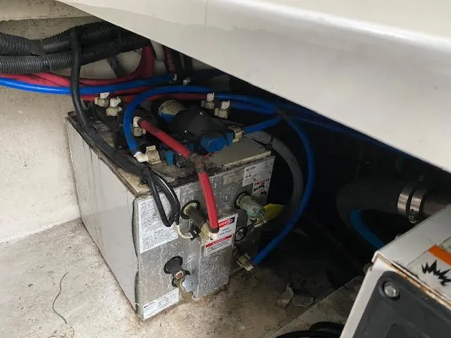 Slide: The Image of 2011 Sea Ray 280 Sundancer engine compartment with battery and wiring. - 20