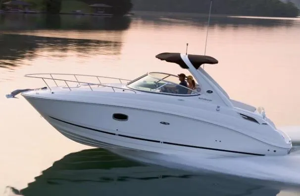 Slide: The Image of 2011 Sea Ray 280 Sundancer cruising on a calm lake at sunset. - 3