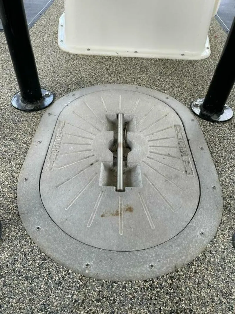 Slide: The Image of Hatch cover on a 1997 Custom 31 Center Console boat. - 23