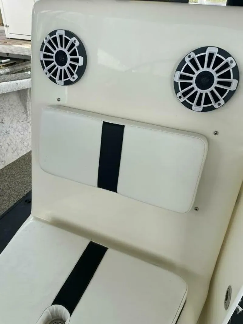 Slide: The Image of 1997 Custom 31 Center Console boat seat with dual speakers. - 25