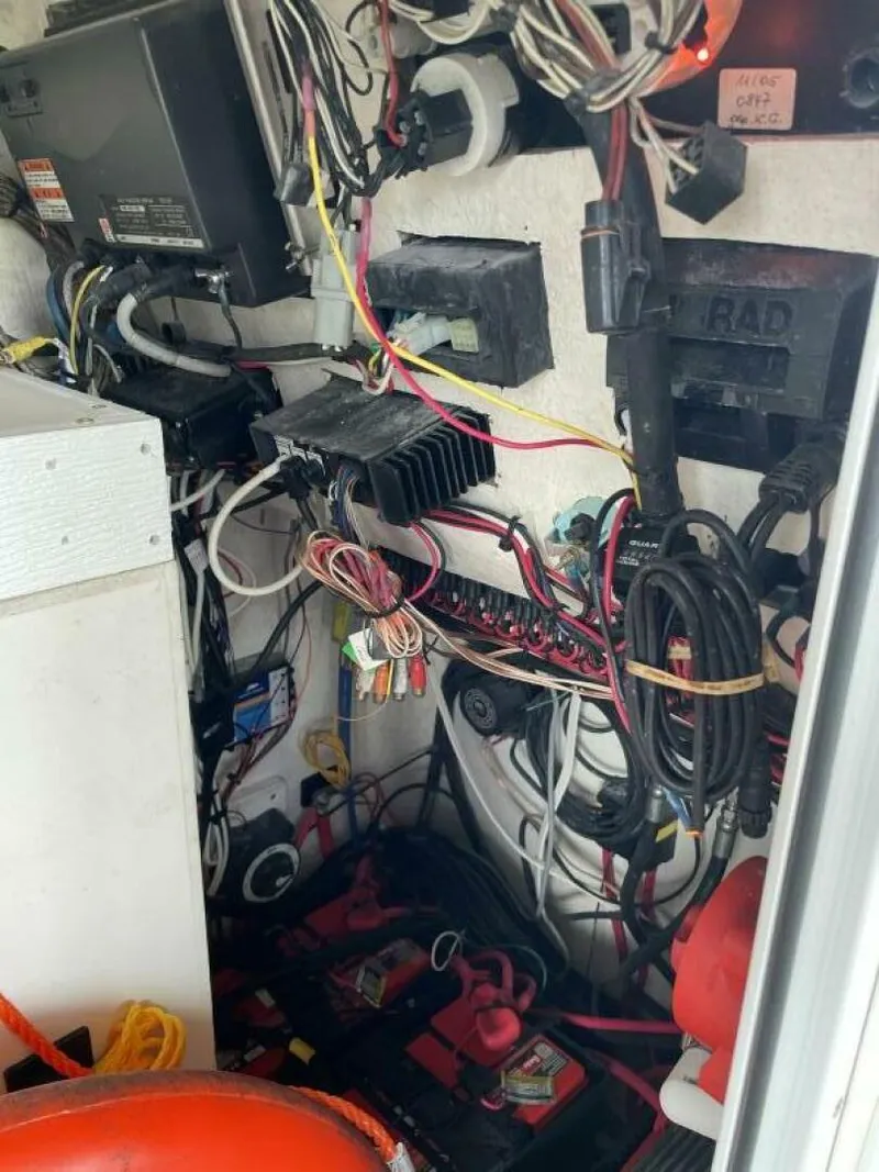 Slide: The Image of Electrical wiring and components inside a 1997 Custom 31 Center Console boat. - 38