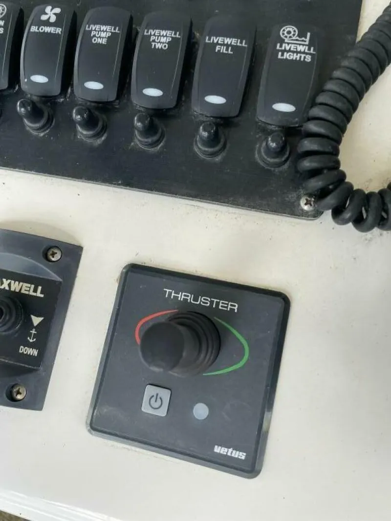 Slide: The Image of Control panel of a 1997 Custom 31 Center Console boat with thruster joystick. - 7