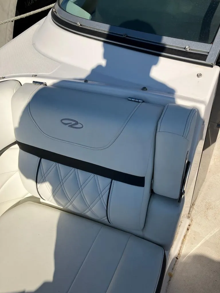 Slide: The Image of 2020 Regal 26 OBX boat with white leather seating and logo. - 14