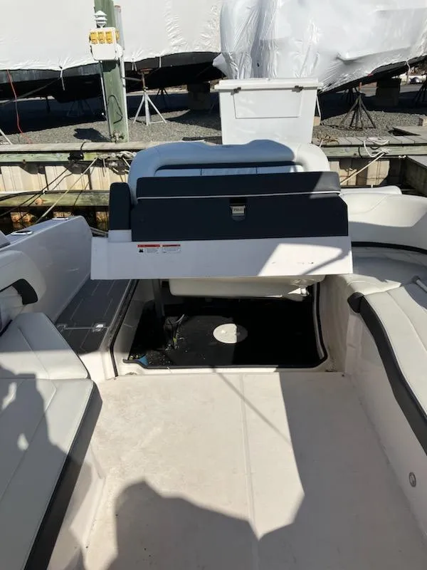 Slide: The Image of 2020 Regal 26 OBX boat interior with seating and storage. - 17