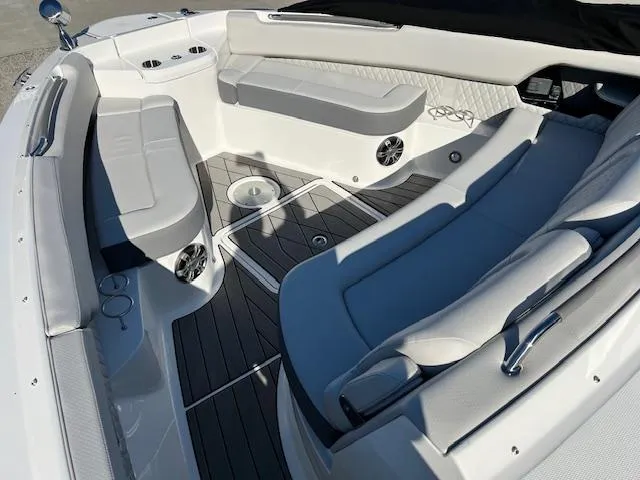 Slide: The Image of 2024 Sea Ray SLX 400 OB boat interior with luxurious seating and modern design. - 12