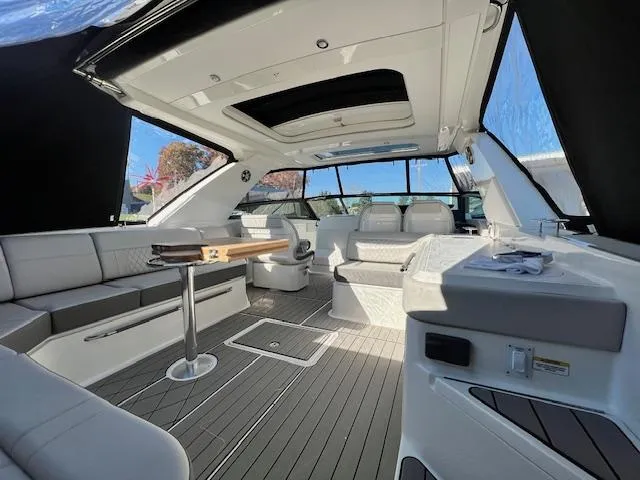 Slide: The Image of Interior of a 2024 Sea Ray SLX 400 OB luxury boat with modern seating and table. - 17