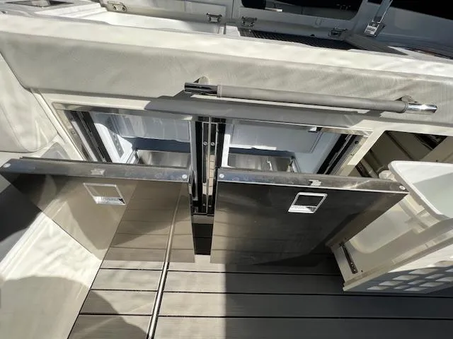 Slide: The Image of 2024 Sea Ray SLX 400 OB yacht with open storage compartments - 26