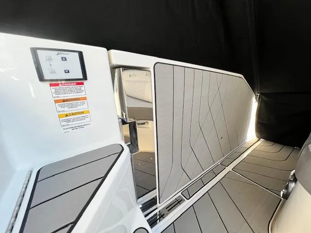Slide: The Image of 2024 Sea Ray SLX 400 OB interior with modern design and safety instructions. - 30