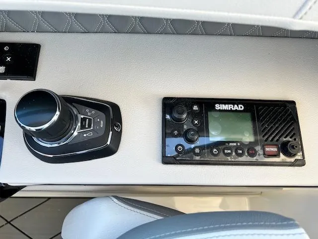 Slide: The Image of Control panel of 2024 Sea Ray SLX 400 OB with Simrad electronics. - 38