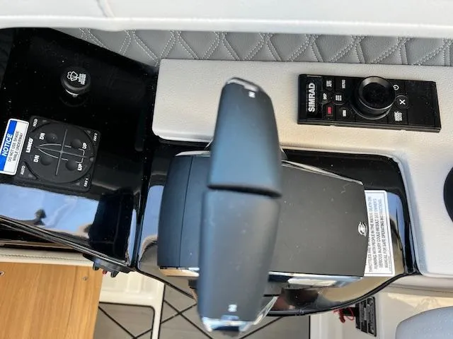 Slide: The Image of 2024 Sea Ray SLX 400 OB control panel with joystick and Simrad display. - 39