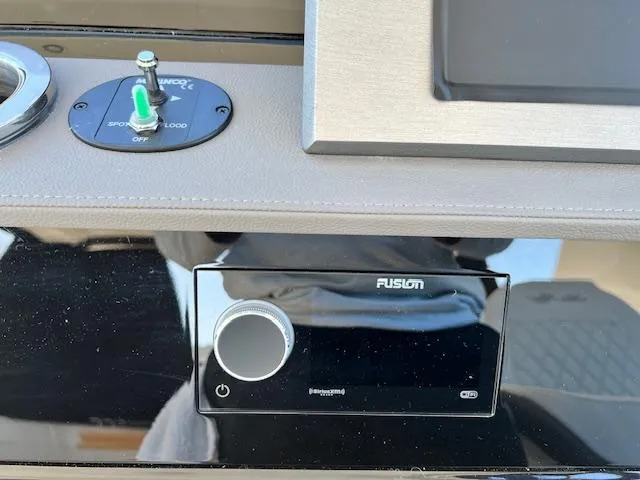 Slide: The Image of 2024 Sea Ray SLX 400 OB dashboard with Fusion stereo system. - 41