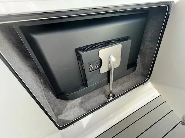 Slide: The Image of Built-in TV compartment on 2024 Sea Ray SLX 400 OB boat. - 44