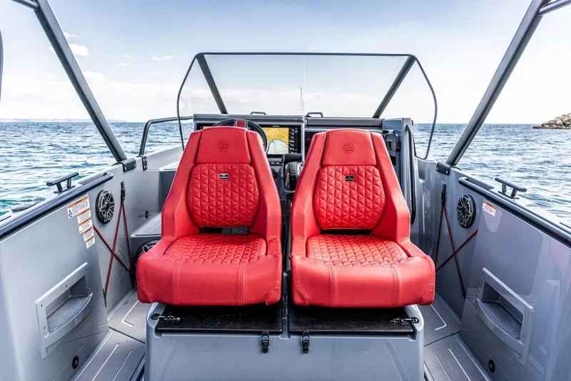 Slide: The Image of 2024 BRABUS SHADOW 300 CT boat with red seats on open water. - 12