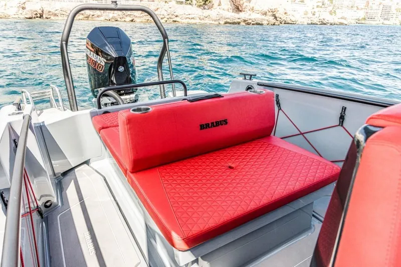 Slide: The Image of 2024 BRABUS SHADOW 300 CT boat with red seating on the water. - 14