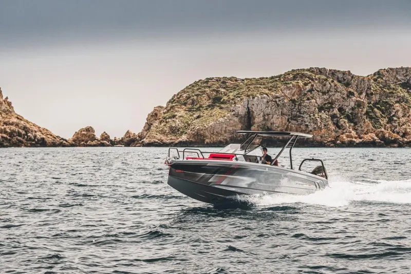 Slide: The Image of BRABUS SHADOW 300 CT 2024 cruising near rocky coastline. - 3